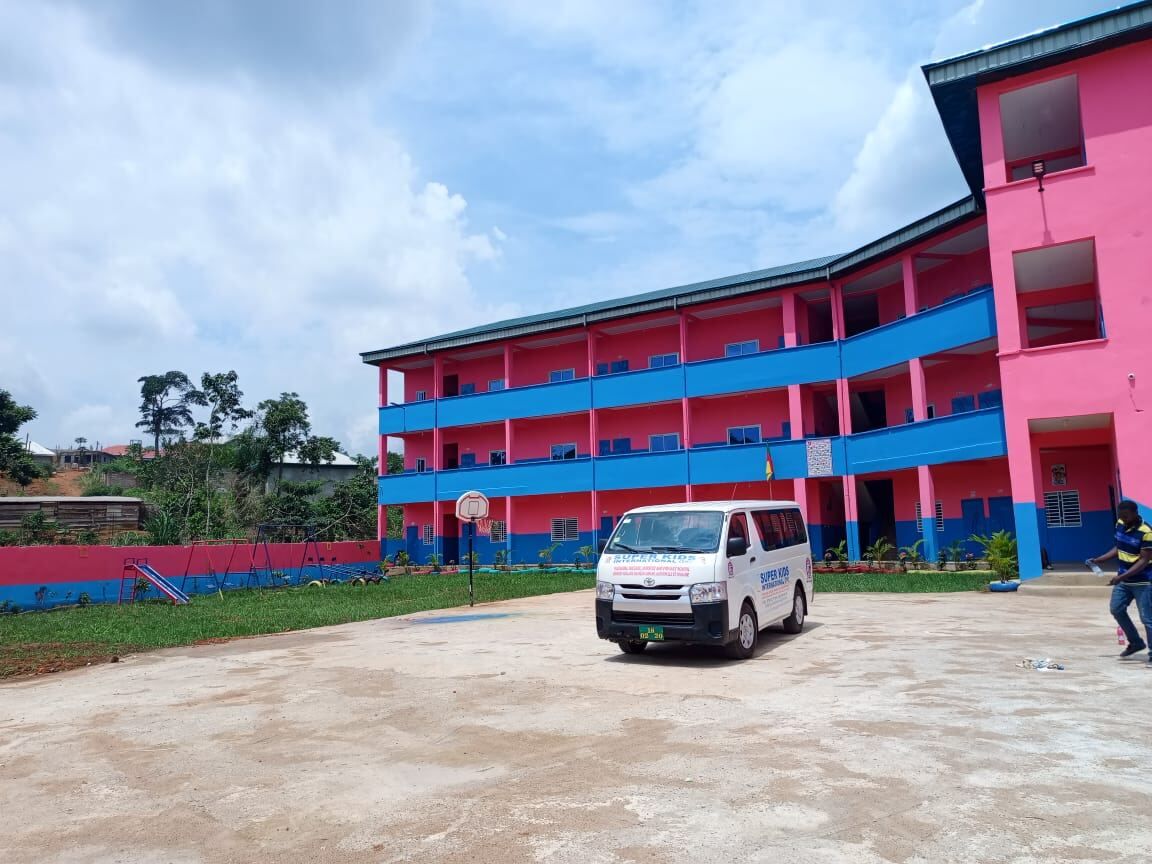 Campus building and playground on a cloudy day