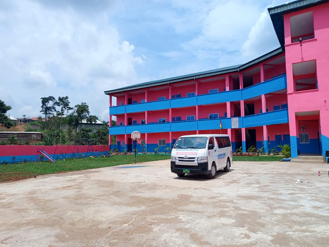 Super Kids International School campus building with outdoor play area