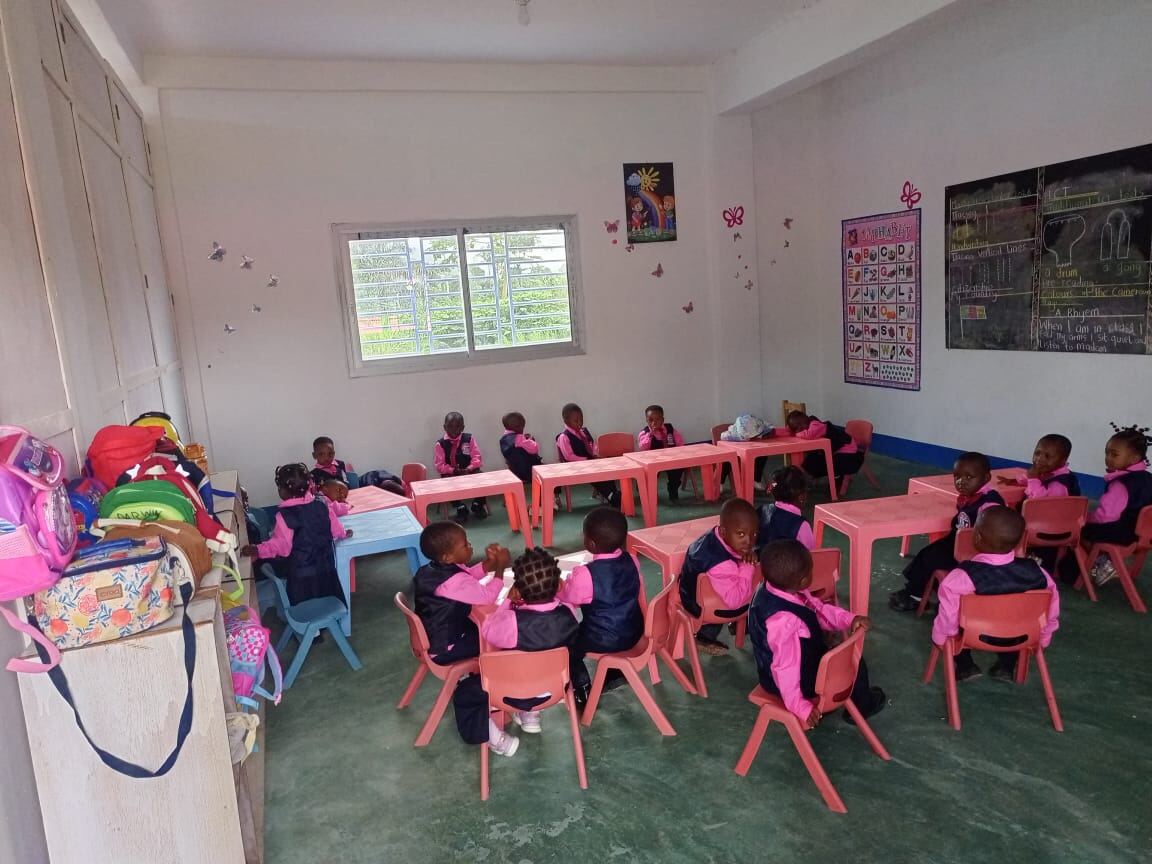 Nursery pupils seated together in the classroom