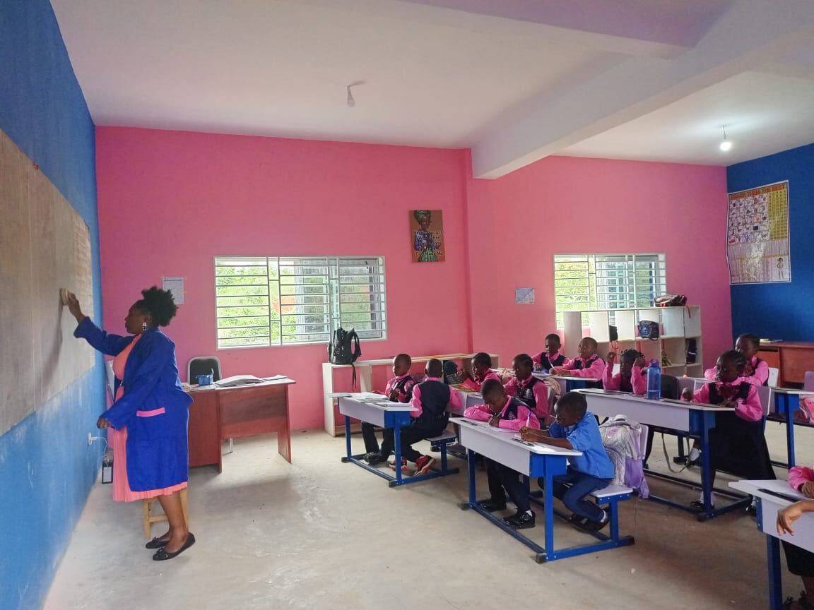 Teacher leading a lesson at the blackboard