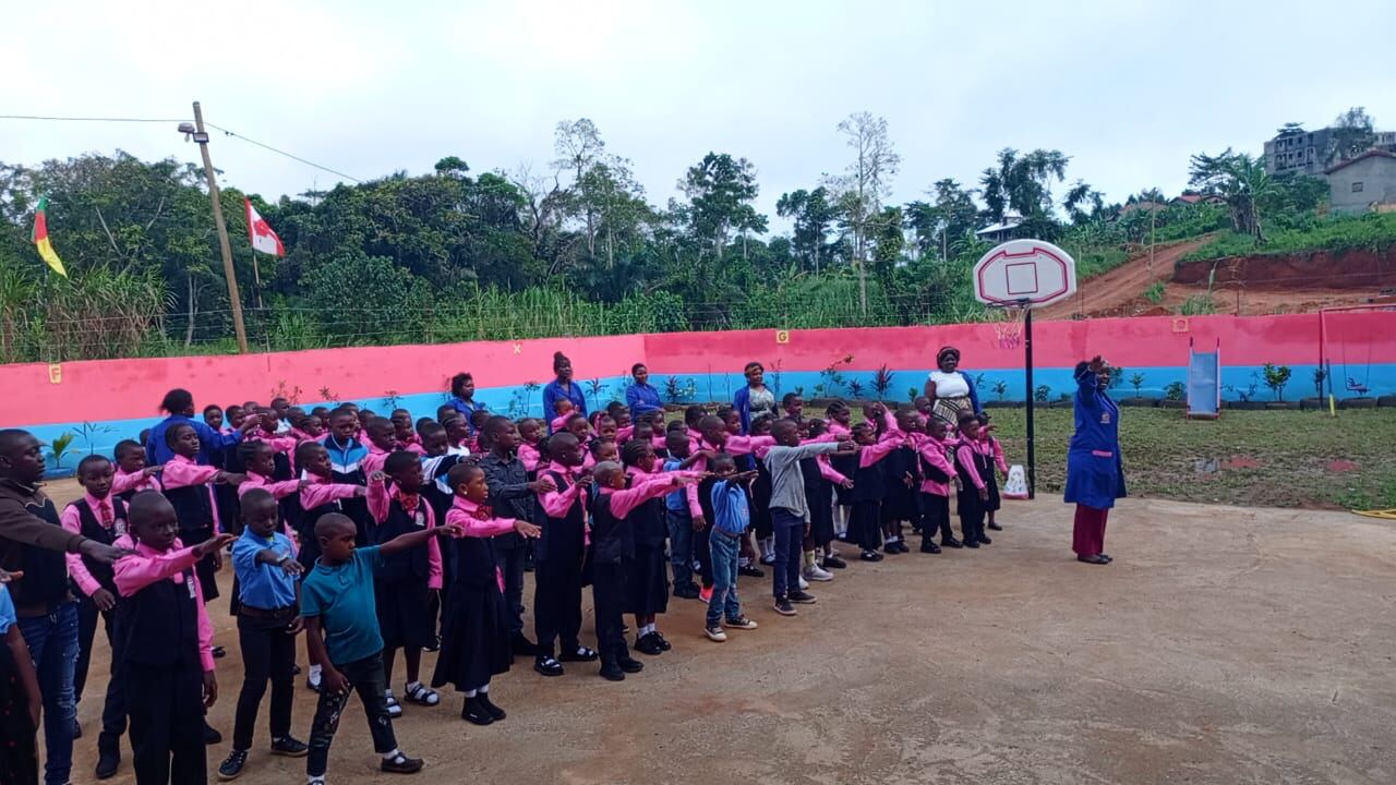 Pupils lined up for an activity in the school yard