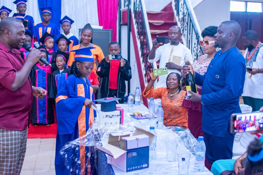 Graduation celebration with pupils in cap and gown